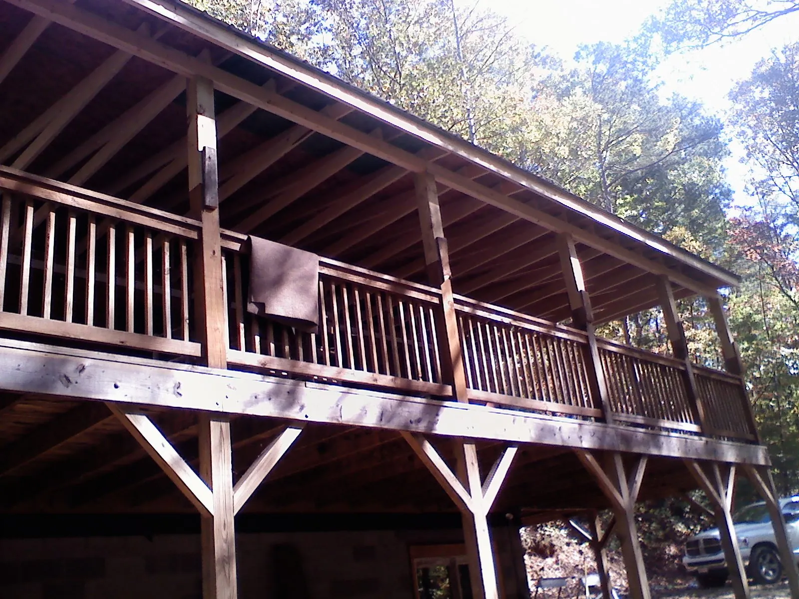 Timber framing under a new elevated porch and deck — Roof Leak Repair in Canton Center by Roofing Brothers